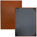 Two brown leather H. Risch Inc. Tamarac menu covers with black trim.