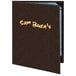 A brown Menu Solutions Slim Line menu cover with yellow writing on it.