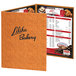 A brown Menu Solutions Water Street wicker menu cover with a white price list.
