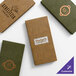 A set of customizable wicker-textured menu covers in green and brown colors, each featuring different restaurant logos.