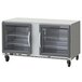 A Beverage-Air undercounter refrigerator with glass doors on wheels.