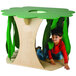 A child playing in a Whitney Brothers jungle tree house shaped like a tree.