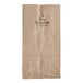 A Duro brown paper bag with black text that says "2 lb."