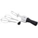 An OXO stainless steel manual crank egg beater with black rubber handles and two whisks.