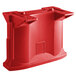 A red plastic container with holes on a table with red plastic rails attached to it.