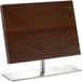 A wooden knife board on a metal stand.