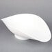 A white bowl with a curved edge.