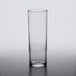 An Arcoroc highball glass on a white surface.