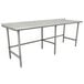 A stainless steel Advance Tabco commercial work table with a backsplash and open base.