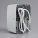 a white wires attached to a grey box