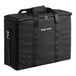 A large black carrying case with handles and a zipper, branded with 'Breville Commercial' on the front.