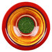 A white melamine bowl with a red and yellow bowl with a green swirl.