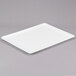 A white rectangular tray on a gray background.