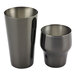 A pair of gun metal black stainless steel cups.