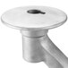 A metal dough hook with a hole in the center.