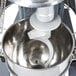 A Vollrath commercial floor mixer with a spiral dough hook inside.