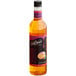 A bottle of DaVinci Gourmet Passion Fruit syrup with a pink label.
