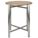 A stainless steel table base with metal legs.