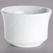 a white bowl on a gray surface