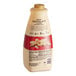 A close-up of a Torani Puremade White Chocolate Flavoring Sauce bottle.