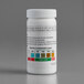 A white bottle of Serim 5148Q Chlorine Test Strips on a gray surface.