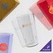 A variety of Cambro amber plastic tumblers.