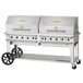 A large silver Crown Verity outdoor grill with wheels.