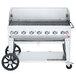 A Crown Verity liquid propane outdoor grill with wheels.