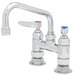 A chrome T&S deck-mounted pantry faucet with two blue handles.