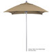 A tan California Umbrella with a Sunbrella canopy on a metal pole.