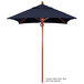 A blue California Umbrella with a wooden pole and a blue Sunbrella canopy.