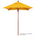 A yellow California Umbrella with a wooden pole.