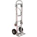 A silver Magliner convertible hand truck with black wheels and a U-loop handle.