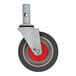 The wheel of a Magliner Gemini Jr. hand truck with a metal and red base.