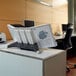 a person's leg in a chair at a desk
