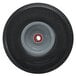 A black wheel with a grey rim on a Magliner hand truck.