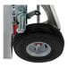 A Magliner hand truck wheel with a tire on a white background.