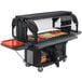 A black Cambro food cart with a tray of vegetables on a table at a food buffet.