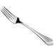 a silver fork on a white background