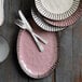 A plate with a Reserve by Libbey stainless steel dinner fork and knife on it.