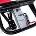 A close-up of the power switch on a red and black Magliner motorized hand truck.