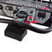 A close-up of a black and silver Magliner Motorized Dewar Cart remote control.