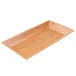 An American Metalcraft rectangular bamboo tray on a table.