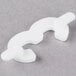 A white plastic Ketchum Manufacturing number 3 deli tag insert on a grey surface.