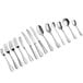 A row of Acopa Vernon stainless steel bouillon spoons.