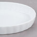 A white fluted oval CAC china dish.