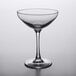 An Arcoroc clear wine glass with a stem.