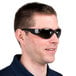 A man wearing black Cordova safety glasses with gray lenses.