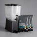 A Crown Beverages cold brew system with coffee bags on a black surface.