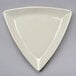 A white triangle shaped Tuxton china plate.